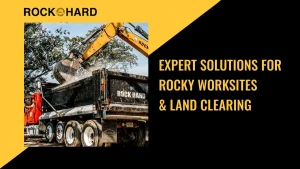 Land clearing contractor managing rocky worksite with professional equipment.
