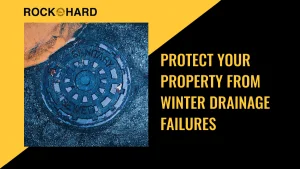 Winter stormwater runoff near home with ice and melting snow around drainage areas