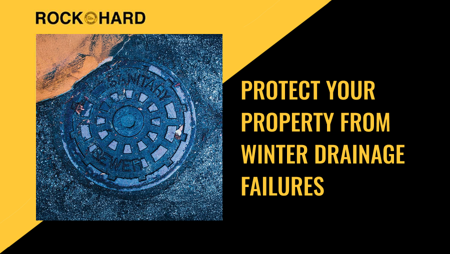 Winter stormwater runoff near home with ice and melting snow around drainage areas